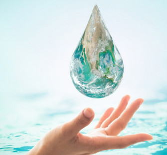 hand catching a large drop of water