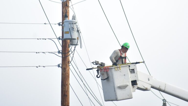 Line worker in a lift bucket